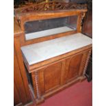 A mid Victorian figured walnut mirror back chiffonier, having raised and pierced superstructure over