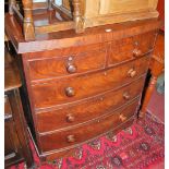 A mid 19th century mahogany and flame mahogany bowfront chest of two short over three long