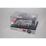 A Carrera limited edition Mercedes 300SLR slot car clock with sound effects