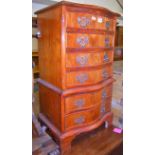 A reproduction yew wood serpentine front bedside chest of six long drawers, width 45cm