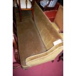 A late 19th century mahogany framed and upholstered long waiting room seat, raised on turned