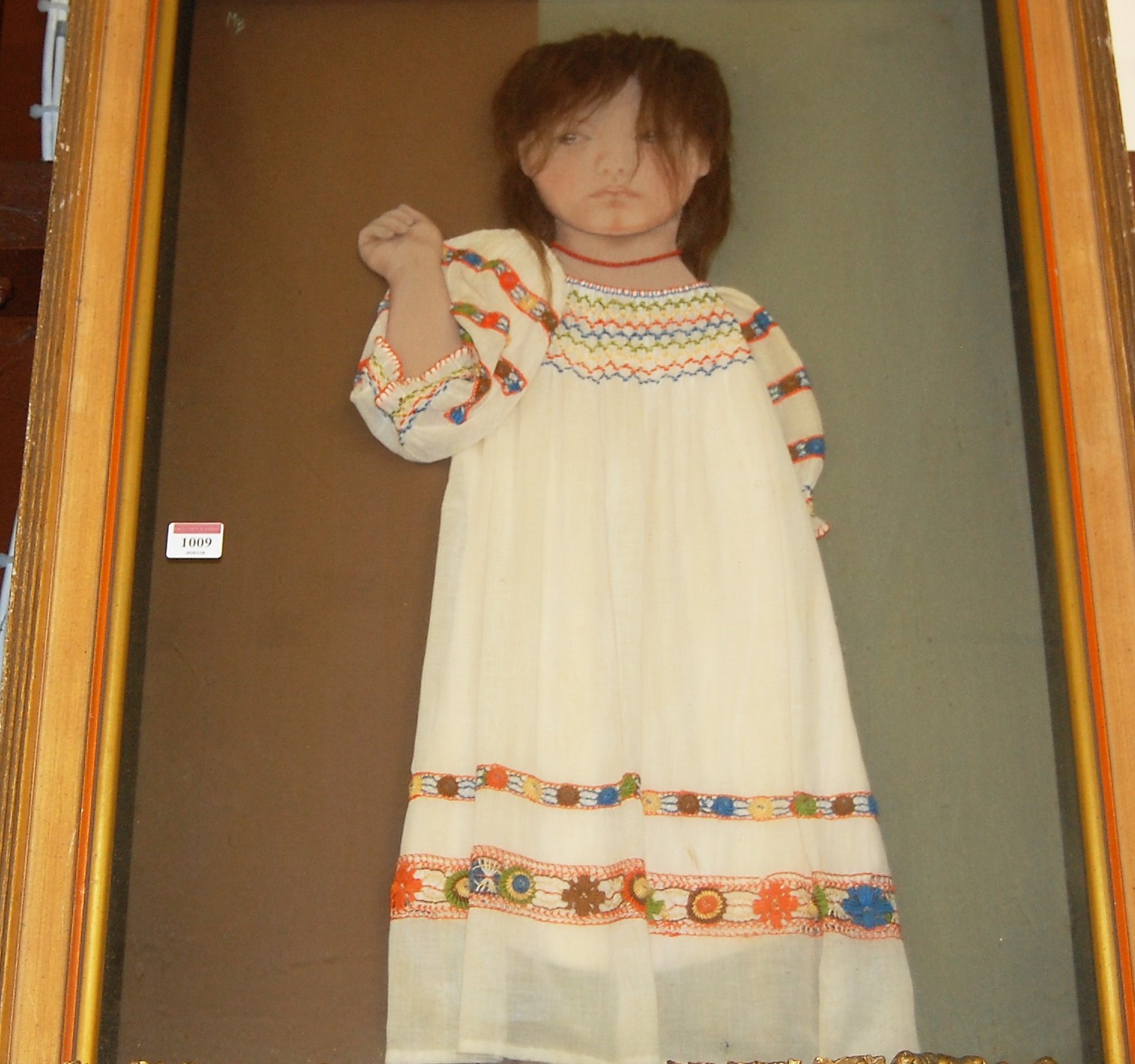 Unsigned - Study of a young girl wearing coral necklace, mixed media textile housed in glazed box