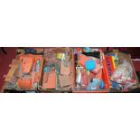 Four boxes containing a quantity of mixed plastic tinplate and diecast toys all suitable for