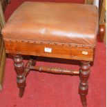 An Edwardian walnut piano stool