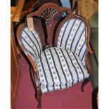 A near-pair of Edwardian mahogany and floral striped upholstery tub salon chairs
