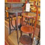 An Edwardian mahogany oval two-tier occasional table; together with a three-tier folding cake-