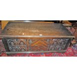 An early 20th century hinged top blanket box, having a floral relief carved front panel, w.102cm