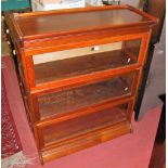 An early 20th century three tier mahogany Globe Wernicke type stacking bookcase (lacking handles)