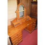 A modern pine long dressing table, with swing mirror back, w.150cm