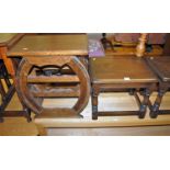 A pair of Ercol dark elm low occasional tables; together with an oak wine rack occasional table (3)