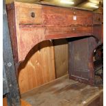 An early 20th century oak and elm hinge top school desk, having three various frieze drawers,