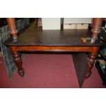 A Victorian mahogany round cornered extending dining table, raised on bulbous reeded supports (