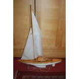 A large wooden and plastic hulled sailing yacht fitted with radio control, and named Mistral