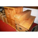 A pine double door cupboard; pine blanket box; and a pine hinged top box with brass fittings (3)
