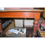 A late Victorian oak extending dining table, having wind-out action and two extra drop-in leaves,