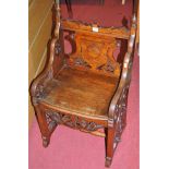 A late Victorian carved and pierced oak panelled reliquary chair, width 47cm