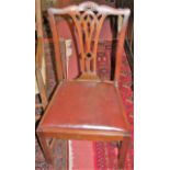 A set of eight early 20th century mahogany Chippendale style dining chairs, each having tan