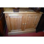 A modern pine low double door side cupboard, w.91cm