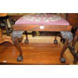 A Georgian style mahogany and tapestry padseat inset dressing stool, raised on acanthus leaf