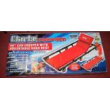 A boxed as issued Clark Strongarm 40" car creeper with adjustable rest