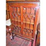 A good circa 1900 mahogany double door astragal glazed bookcase raised on bobbin turned supports,