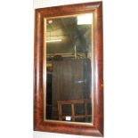 A Victorian flame mahogany framed rectangular wall mirror, 89 x 49cm; together with a further walnut