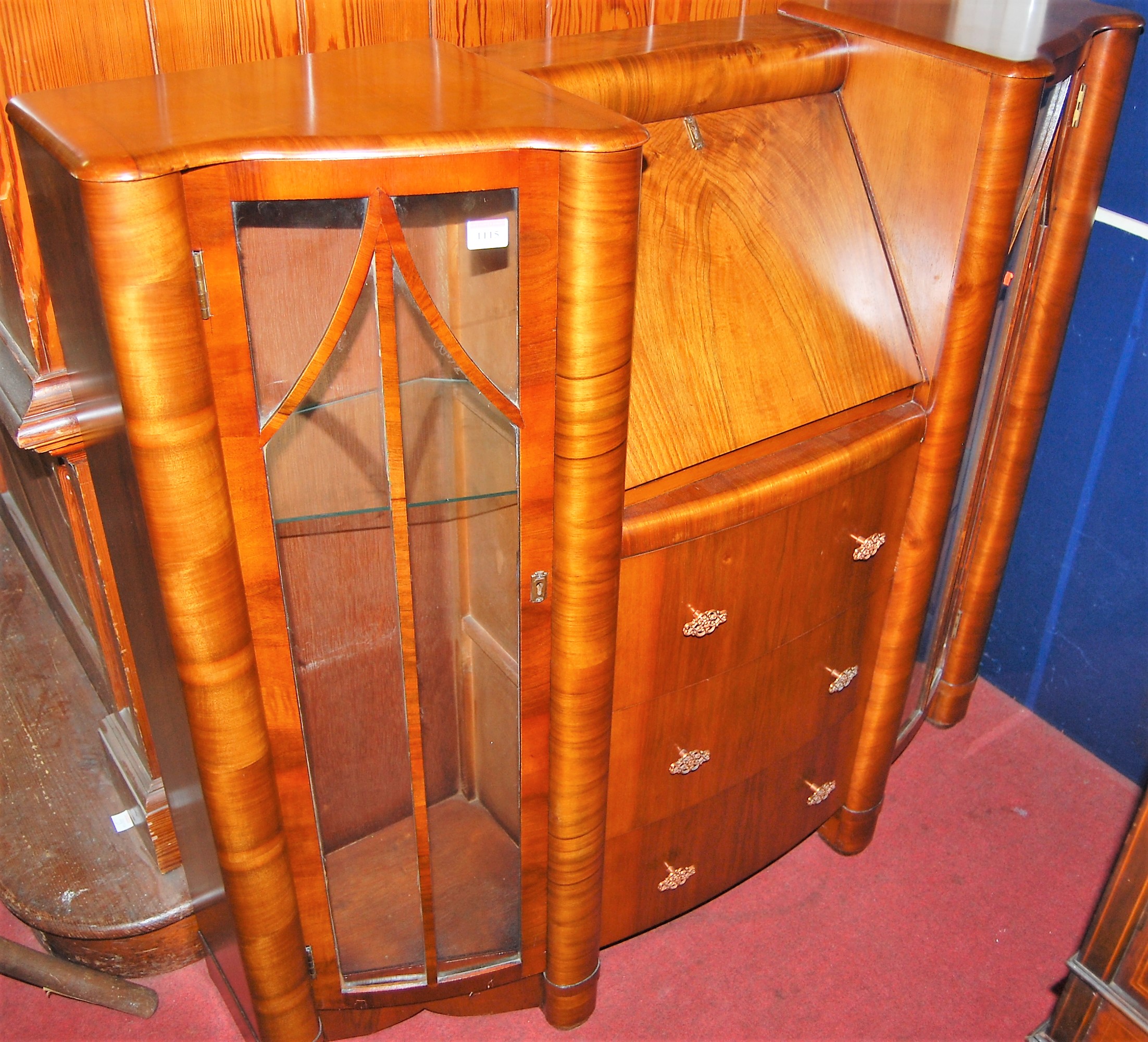 A 1930s figured walnut combination bureau display cabinet, width 122cm