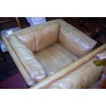 A Danish style light tan leather two-piece lounge suite, comprising two-seater sofa and single