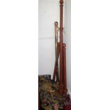 A collection of various contemporary turned curtain poles; and a pair of floral patterned curtains