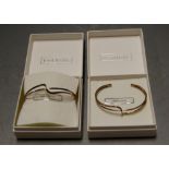 Eight cased silver open ended bangles, in original bag