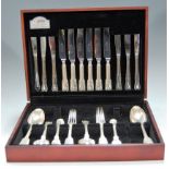 A fitted cutlery canteen, largely containing earlier silver plated flatware in the Fiddle & Thread