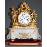 A late 19th century French gilt metal mantel clock, having enamelled dial with Roman numerals,