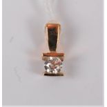 A diamond solitaire pendant, the round brilliant cut diamond, estimated approx. 0.23cts, tension set