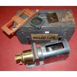 An early 20th century magic lantern, in fitted hardwood case; together with various magic lantern