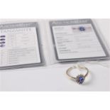 A 14ct white gold certified tanzanite and diamond ring, the oval tanzanite surrounded by small round