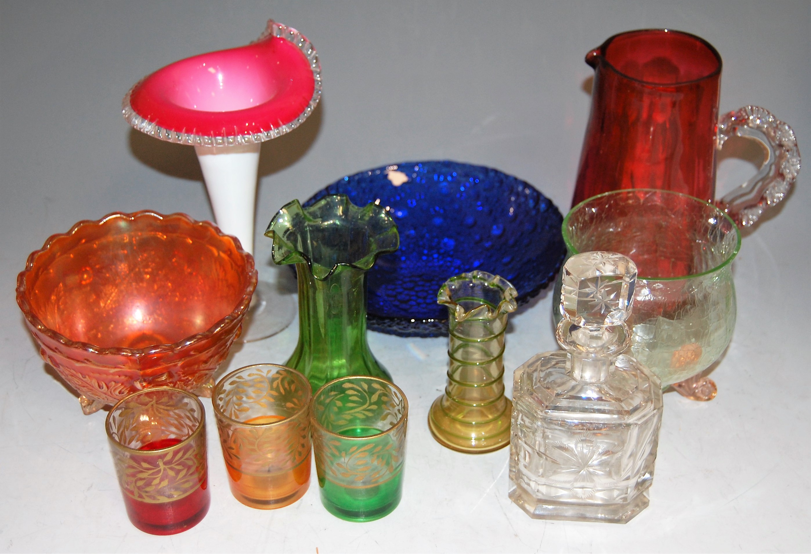 A small collection of miscellaneous glassware to include cranberry glass jug, jack-in-the-pulpit