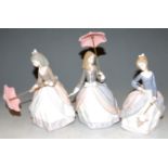 Three various Lladro porcelain figures, each of ladies with parasols, each approx 18cm (excluding