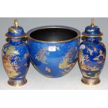 An early 20th century Carlton ware blue lustre jardiniere typically decorated with Chinese pagoda