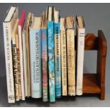 An early 20th century oak book trough, having pokerwork decoration; together with a small collection