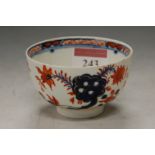 An 18th century Lowestoft porcelain tea bowl, decorated in the Two Birds pattern (a/f)