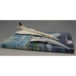 A Space Models diecast model of a Concorde; together with a Matchbox example; and a volume of