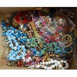 A box of miscellaneous costume jewellery, to include bead necklaces, bangles, faux pearl necklace