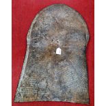 A 19th century Cameroonian stamped metal Kirdi shield, 82 x 51cm; together with four associated