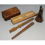 A box of miscellaneous items, to include hand bell surmounted by a Black Forest style bear, cribbage