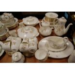 A quantity of Royal Doulton Yorkshire Rose pattern tablewares, to include teapot, coffee pot,