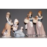 A Lladro figure of a girl in standing pose with a basket and puppies, 24cm; together with three