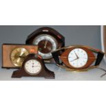 A 1950s oak cased mantel clock; together with three others (4)