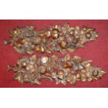 A pair of carved pine and gilt painted wall hangings each in the form of fruiting vines, height