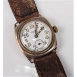 A vintage gentleman's wristwatch by JW Benson , London, the white enamel dial with Arabic