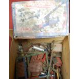 A large box containing a quantity of used Meccano, to include 1950s red and green examples